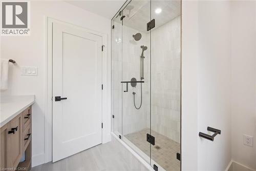 4-pc ensuite with a spacious tile & glass shower & white oak vanity - 548 Peach Blossom Court, Kitchener, ON - Indoor Photo Showing Bathroom