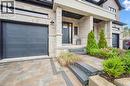 Semi-detached home with a 1-car garage and paver stone driveway & walkway - 548 Peach Blossom Court, Kitchener, ON  - Outdoor 