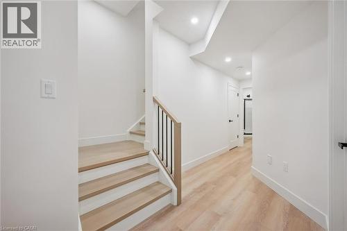 Staircase down to the lower level - 548 Peach Blossom Court, Kitchener, ON - Indoor Photo Showing Other Room