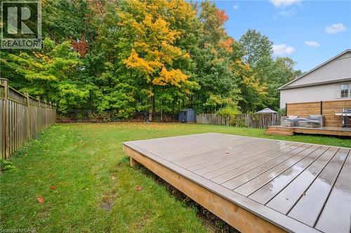 Rear yard is partially fenced and includes a vinyl deck, plenty of yard space and backs onto 8 acres of forest - 548 Peach Blossom Court, Kitchener, ON - Outdoor With Deck Patio Veranda