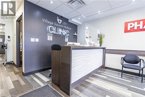 Reception area featuring a paneled ceiling - 10 Main Street, Mississauga, ON 