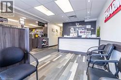 Reception with a drop ceiling and recessed lighting - 