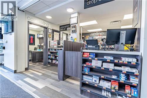 Office area with a paneled ceiling and light wood-type flooring - 10 Main Street, Mississauga, ON 