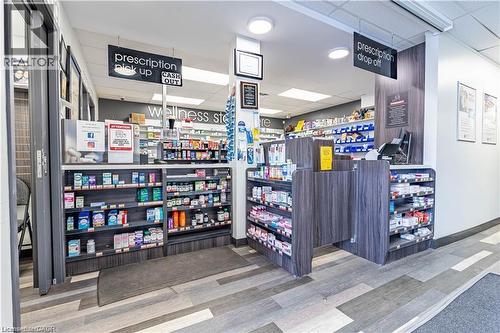 Miscellaneous room featuring a paneled ceiling and light wood-style floors - 10 Main Street, Mississauga, ON 