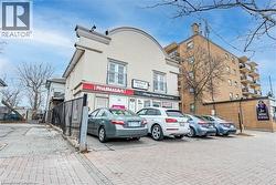 View of commercial property with uncovered parking - 