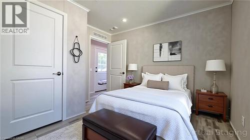Bedroom with crown molding, wood finished floors, and recessed lighting - 24 Macpherson Crescent, Flamborough, ON - Indoor Photo Showing Bedroom