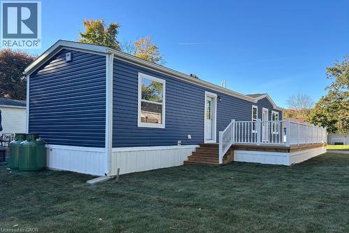 Rear view of property featuring a yard and a deck - 24 Macpherson Crescent, Flamborough, ON - Outdoor With Deck Patio Veranda