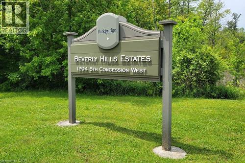 Community sign with a yard - 24 Macpherson Crescent, Flamborough, ON - Outdoor