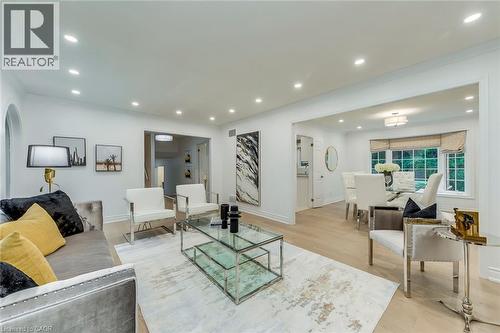Living area featuring light wood-type flooring, recessed lighting, and ornamental molding - 170 Cavendish Court, Oakville, ON - Indoor Photo Showing Living Room