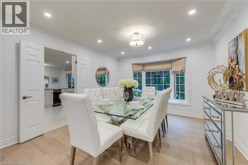 Dining space featuring ornamental molding, light wood-style floors, and recessed lighting - 170 Cavendish Court, Oakville, ON - Indoor Photo Showing Dining Room