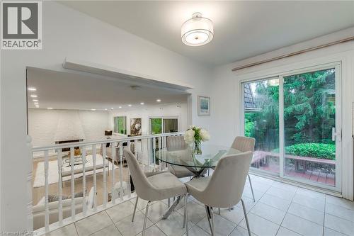 Tiled dining room featuring healthy amount of natural light - 170 Cavendish Court, Oakville, ON - Indoor Photo Showing Dining Room