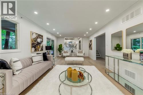 Living room featuring recessed lighting, stairway, light wood-type flooring, and ornamental molding - 170 Cavendish Court, Oakville, ON - Indoor Photo Showing Living Room
