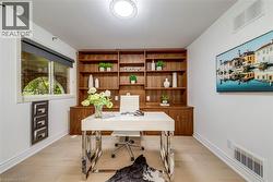 Home office with light wood-style floors and baseboards - 