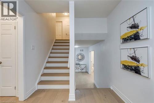 Staircase with wood finished floors and baseboards - 170 Cavendish Court, Oakville, ON - Indoor Photo Showing Other Room
