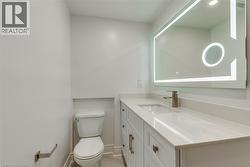 Bathroom featuring vanity and light tile patterned flooring - 