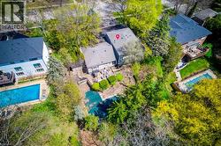 Aerial perspective of suburban area with a pool - 