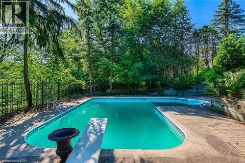 View of swimming pool with a diving board and a patio area - 170 Cavendish Court, Oakville, ON - Outdoor With In Ground Pool With Backyard