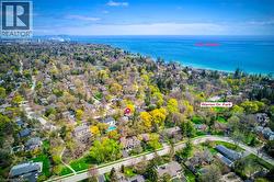 Aerial view of property's location featuring nearby suburban area and a large body of water - 