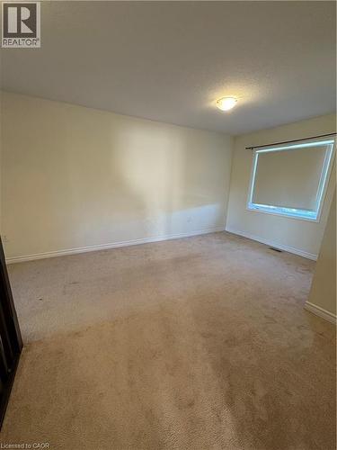 Empty room with carpet and a textured ceiling - 50 Shoreacres Drive, Kitchener, ON - Indoor Photo Showing Other Room