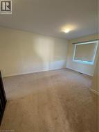 Empty room with carpet and a textured ceiling - 