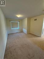 Unfurnished room with light carpet and baseboards - 