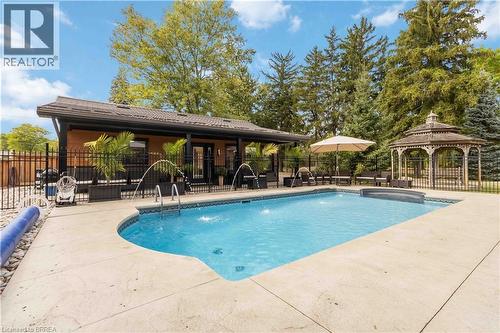 232 Paris Road E, Brantford, ON - Outdoor With In Ground Pool With Deck Patio Veranda With Backyard