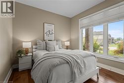 Bedroom with dark wood-style floors - 