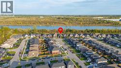 Aerial overview of property's location with nearby suburban area and a large body of water - 