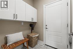 Washroom featuring baseboards and light marble finish floors - 