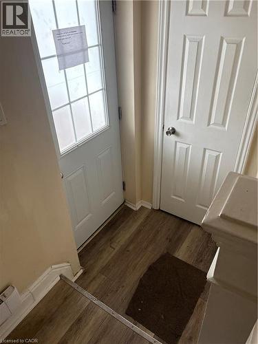 Doorway featuring baseboards and wood finished floors - 95 Sanford Avenue N, Hamilton, ON - Indoor Photo Showing Other Room