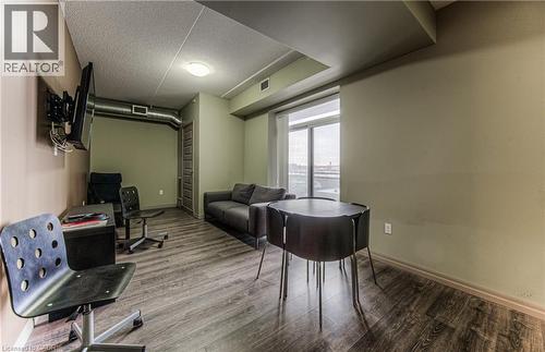 Office featuring hardwood / wood-style floors and a textured ceiling - 8 Hickory Street W Unit# 401, Waterloo, ON - Indoor