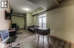 Office featuring hardwood / wood-style floors and a textured ceiling - 