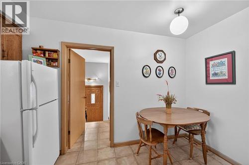 Dining room featuring light tile patterned floors and baseboards - 59 Cloke Court, Hamilton, ON - Indoor Photo Showing Dining Room