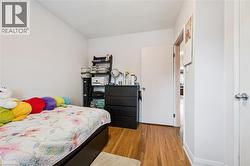 Bedroom featuring light wood-style flooring - 