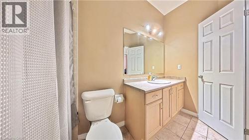 Full bath with vanity, a shower with shower curtain, and light tile patterned flooring - 206 Westmeadow Drive, Kitchener, ON - Indoor Photo Showing Bathroom