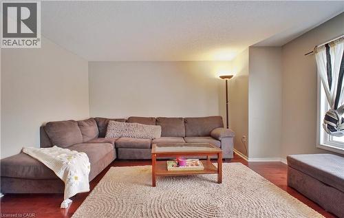 Living room with wood finished floors and a textured ceiling - 206 Westmeadow Drive, Kitchener, ON - Indoor Photo Showing Living Room