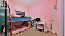 Bedroom featuring carpet and a textured ceiling - 