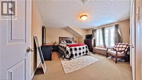 Bedroom featuring light carpet and a textured ceiling - 206 Westmeadow Drive, Kitchener, ON - Indoor