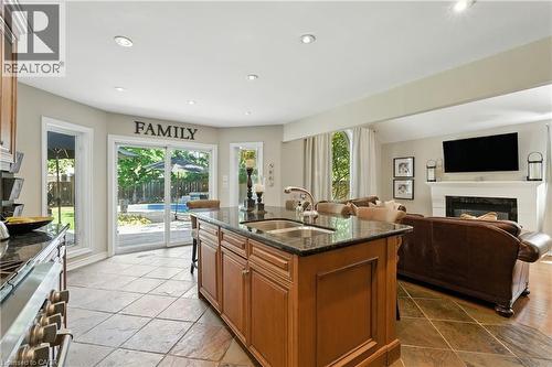 2139 Bushtrail Court, Burlington, ON - Indoor Photo Showing Kitchen With Fireplace With Double Sink