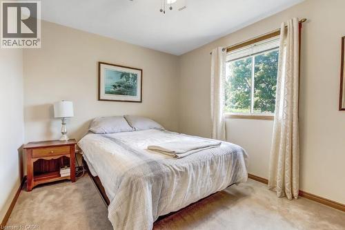 Bedroom with baseboards and light colored carpet - 2 Falls Crescent, Simcoe, ON - Indoor Photo Showing Bedroom