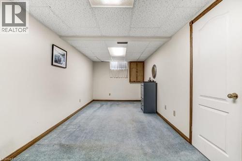 Below grade area with a drop ceiling and carpet floors - 2 Falls Crescent, Simcoe, ON - Indoor
