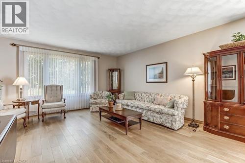 Living room with light wood-style floors - 2 Falls Crescent, Simcoe, ON - Indoor Photo Showing Living Room