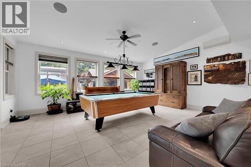 Playroom with billiards, light tile patterned floors, a ceiling fan, an AC wall unit, and vaulted ceiling - 404 Mountain Brow Boulevard E, Hamilton, ON - Indoor Photo Showing Other Room