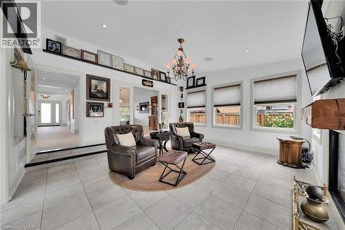 Living area with light tile patterned flooring, a chandelier, healthy amount of natural light, and recessed lighting - 404 Mountain Brow Boulevard E, Hamilton, ON - Indoor Photo Showing Other Room