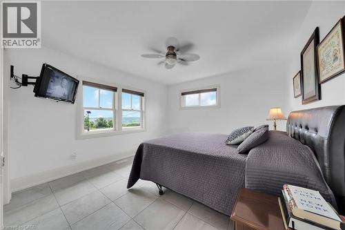 Tiled bedroom featuring a ceiling fan and baseboards - 404 Mountain Brow Boulevard E, Hamilton, ON - Indoor Photo Showing Bedroom