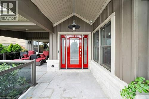 Entrance to property featuring a porch and board and batten siding - 404 Mountain Brow Boulevard E, Hamilton, ON - Outdoor With Exterior