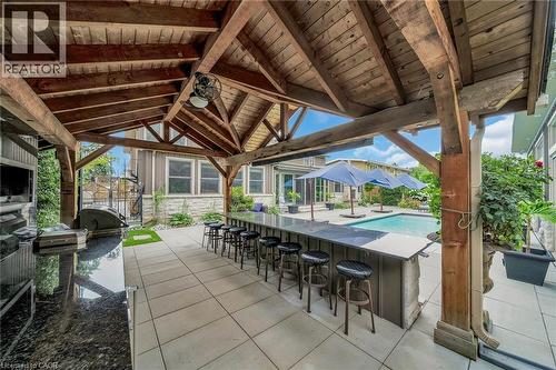 View of patio / terrace with an outdoor pool and grilling area - 404 Mountain Brow Boulevard E, Hamilton, ON - Outdoor With Exterior