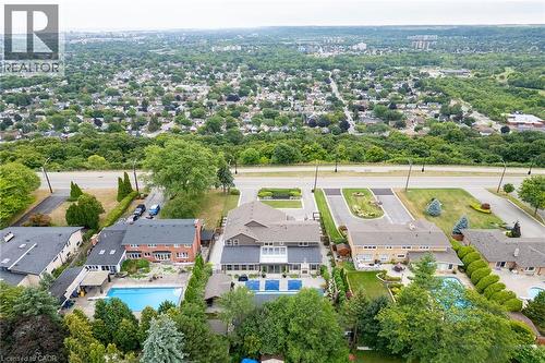 Aerial perspective of suburban area with a pool - 404 Mountain Brow Boulevard E, Hamilton, ON - Outdoor With View