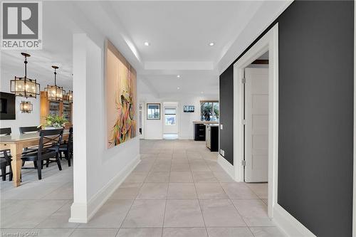 Hall with light tile patterned floors, recessed lighting, a chandelier, and a raised ceiling - 404 Mountain Brow Boulevard E, Hamilton, ON - Indoor Photo Showing Other Room