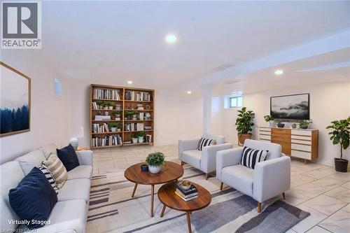 Recreation room staged featuring recessed lighting and light tile patterned flooring - 215 Walter Avenue S, Hamilton, ON - Indoor Photo Showing Living Room